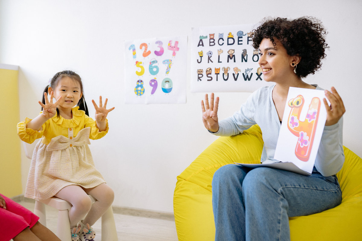 Smiling teacher with student